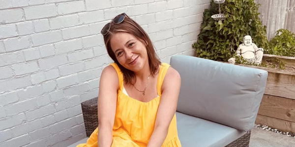 Young woman sitting on a chair and smiling