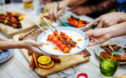 People passing food across a table