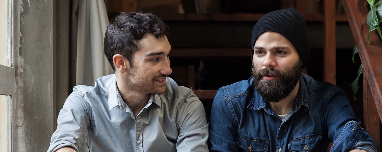 Two men having a conversation with each other